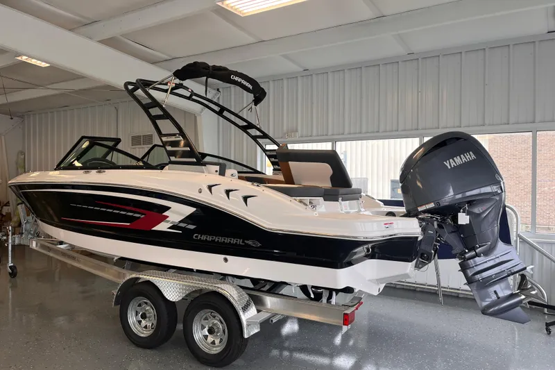 Slide: The Image of 2025 Chaparral 21 SSi OB boat with Yamaha outboard engine in showroom. - 2