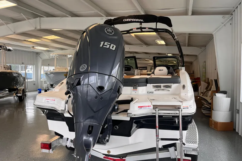 Slide: The Image of 2025 Chaparral 21 SSi OB boat with 150 HP engine in showroom. - 3