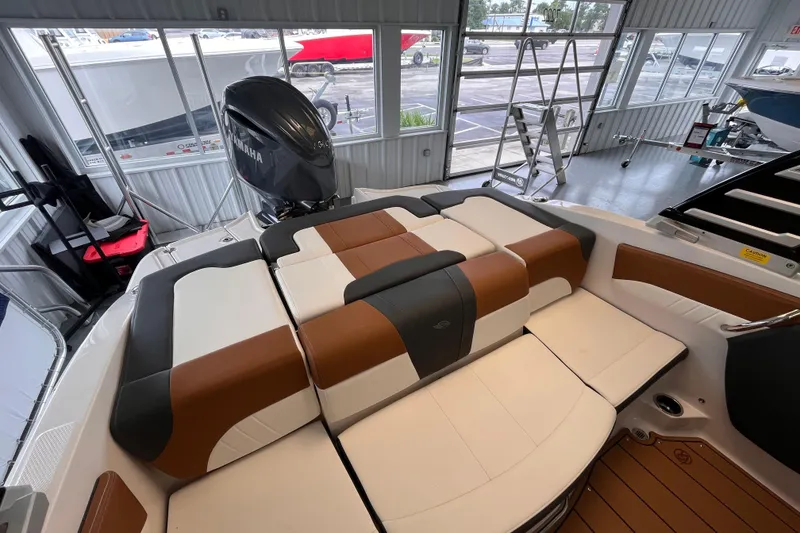 Slide: The Image of 2025 Chaparral 21 SSi OB boat interior with Yamaha outboard motor in showroom. - 5