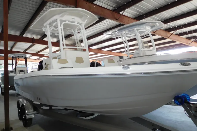 The Image of 2026 Robalo 226 Cayman boat in a covered storage facility. - 1