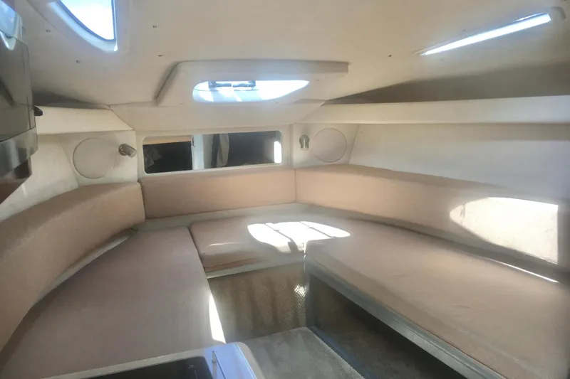 Slide: The Image of Interior cabin of 2010 Sea Ray 260 Sundancer, featuring cozy seating and natural light. - 15
