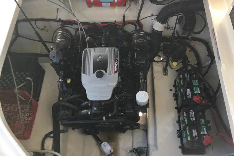 Slide: The Image of Engine compartment of 2010 Sea Ray 260 Sundancer with visible batteries and wiring. - 21