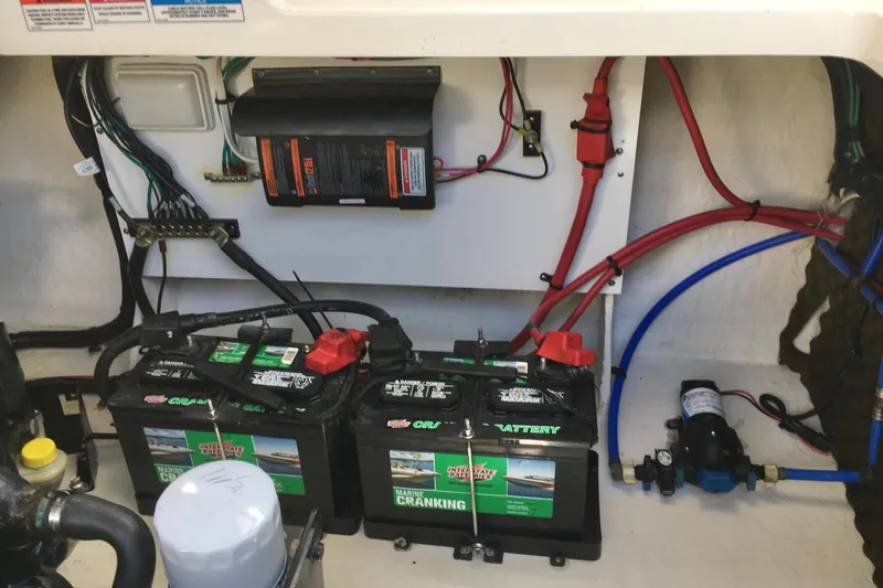 Slide: The Image of Engine compartment of 2010 Sea Ray 260 Sundancer with batteries and wiring. - 22