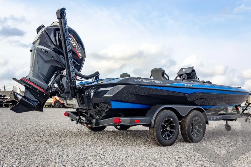 Slide: The Image of 2026 Skeeter ZXE21 boat with powerful outboard motor on a trailer. - 12