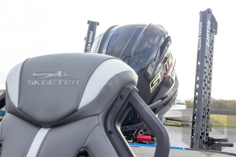 Slide: The Image of 2026 Skeeter ZXE21 boat seat and motor with Minn Kota Raptor anchors. - 20