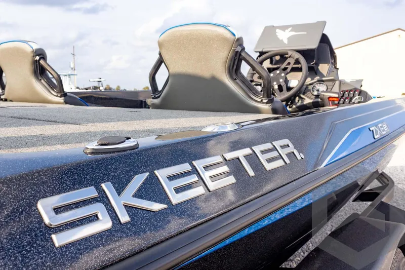 Slide: The Image of 2026 Skeeter ZXE21 boat with sleek design and modern features. - 28