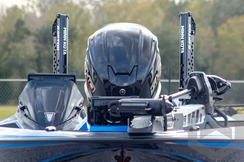 Slide: The Image of 2026 Skeeter ZXE21 boat with Minn Kota Raptor anchors and Yamaha engine, rear view. - 3