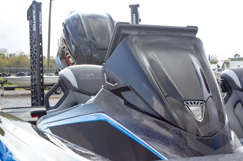 Slide: The Image of 2026 Skeeter ZXE21 boat with Minn Kota Raptor, sleek design and powerful engine. - 30