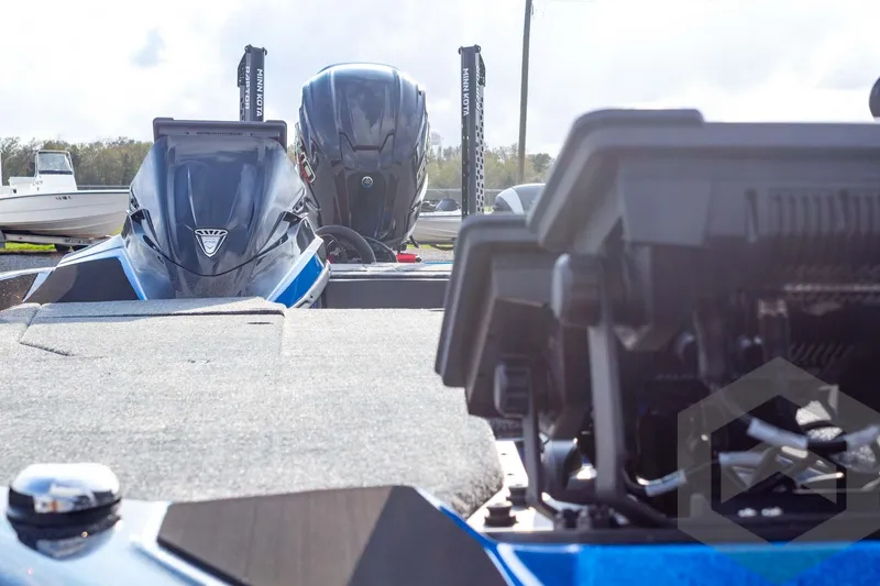 Slide: The Image of 2026 Skeeter ZXE21 boat with advanced navigation equipment and dual engines. - 32