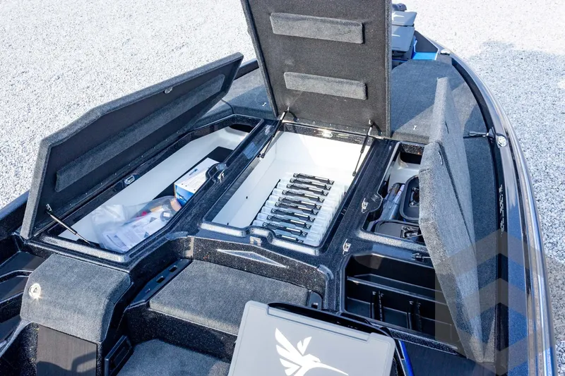 Slide: The Image of 2026 Skeeter ZXE21 boat storage compartments open, showcasing organized interior layout. - 35
