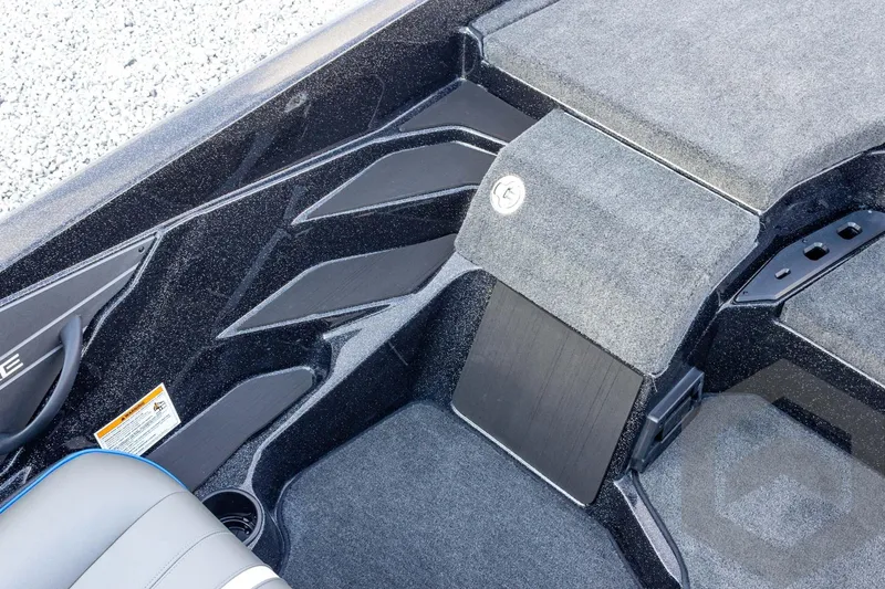 Slide: The Image of Interior of 2026 Skeeter ZXE21 boat, featuring carpeted flooring and storage compartments. - 45