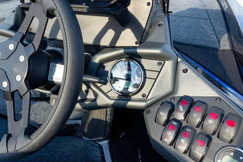 Slide: The Image of Steering wheel and dashboard controls of 2026 Skeeter ZXE21 boat. - 51