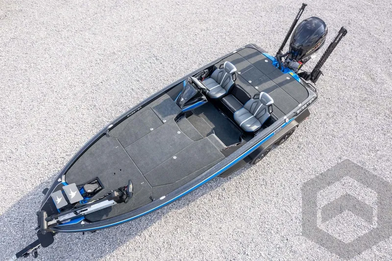 Slide: The Image of 2026 Skeeter ZXE21 fishing boat with dual seats and advanced motor, on gravel surface. - 60