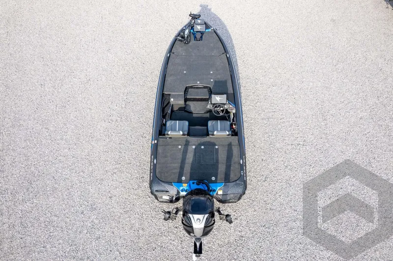 Slide: The Image of 2026 Skeeter ZXE21 fishing boat, aerial view, on gravel surface. - 63