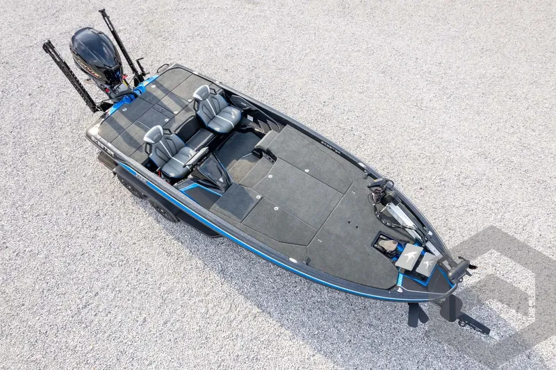 Slide: The Image of 2026 Skeeter ZXE21 fishing boat with dual seats and modern design on gravel surface. - 66