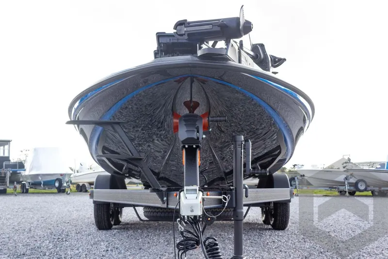 Slide: The Image of 2026 Skeeter ZXE21 boat on trailer, front view, parked on gravel. - 9