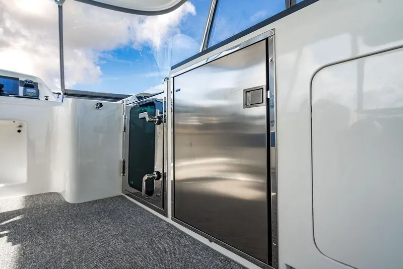 Slide: The Image of Interior of Lanzarote Ventuno 73 yacht, 2013 model, featuring sleek stainless steel cabinetry. - 27