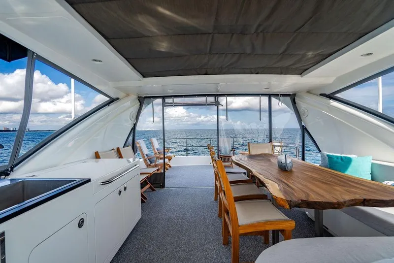 Slide: The Image of Luxurious Lanzarote Ventuno 73 yacht interior with ocean view, featuring elegant dining area, 2013 model. - 32