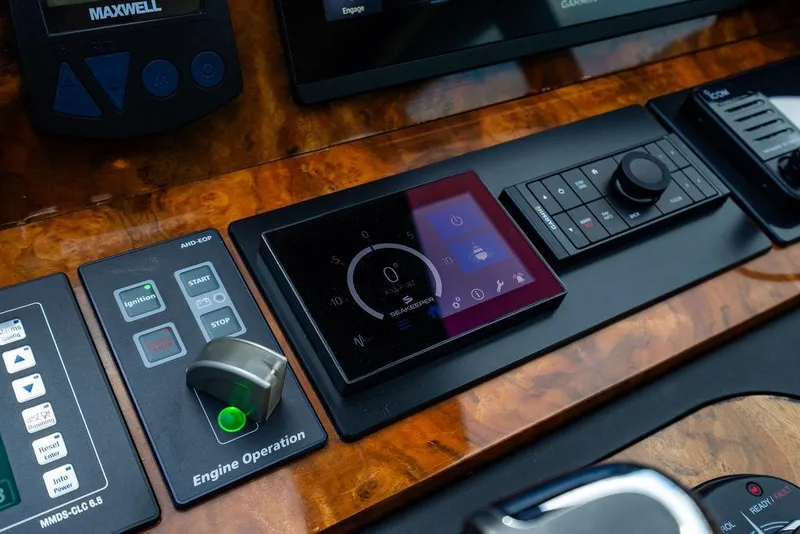 Slide: The Image of Control panel of Lanzarote Ventuno 73 yacht, 2013 model, featuring advanced navigation and engine controls. - 60