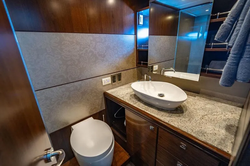 Slide: The Image of Luxurious bathroom in Lanzarote Ventuno 73 yacht, featuring modern sink and elegant wood finishes. - 72