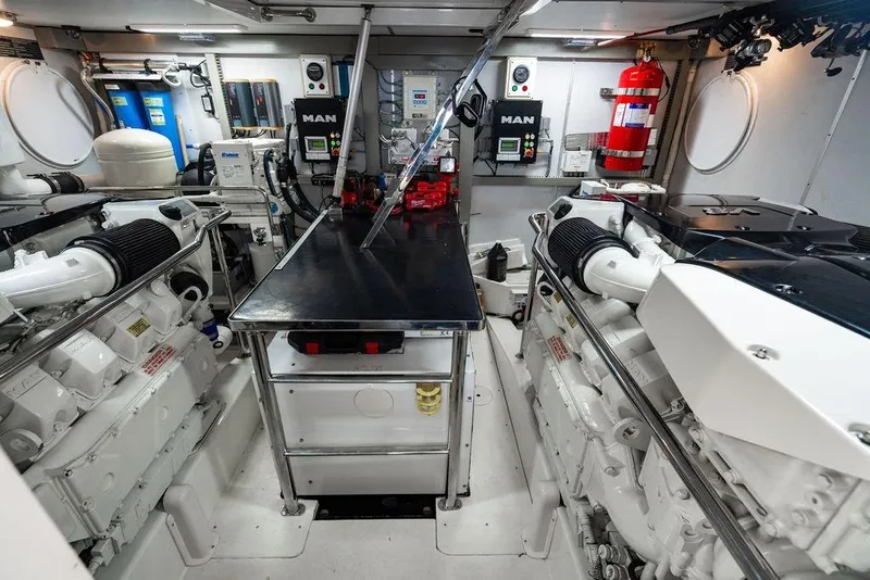 Slide: The Image of Engine room of 2013 Lanzarote Ventuno 73 yacht, featuring dual MAN engines and equipment. - 87