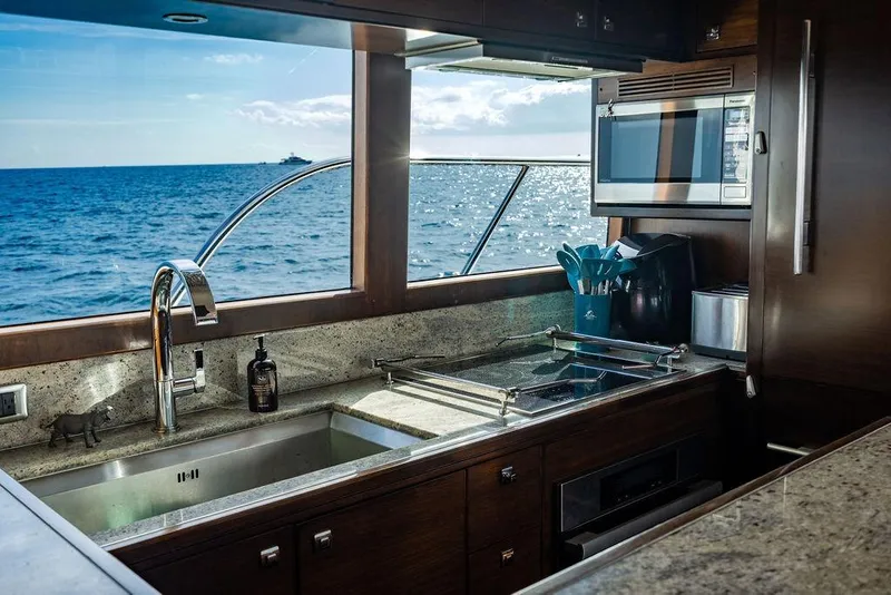 Slide: The Image of Luxurious kitchen interior on Lanzarote Ventuno 73 yacht, ocean view through window. - 47