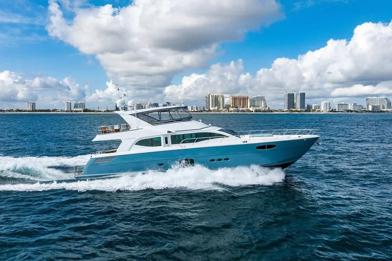Slide: The Image of Luxury yacht Lanzarote Ventuno 73 cruising on ocean, city skyline in background, 2013 model. - 7