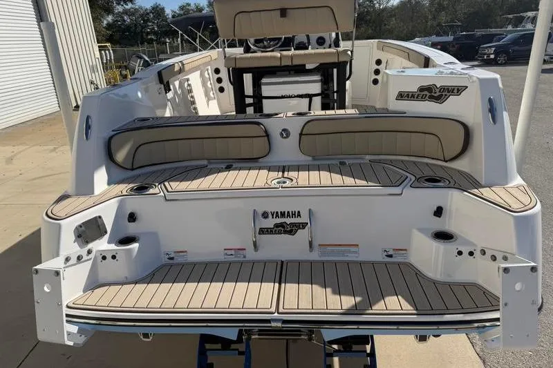 Slide: The Image of 2024 Yamaha Boats 222 FSH Sport, rear view, showcasing deck and seating area. - 11