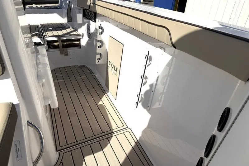 Slide: The Image of 2024 Yamaha Boats 222 FSH Sport interior with sleek deck and seating. - 26