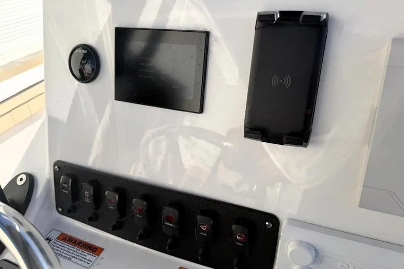 Slide: The Image of 2024 Yamaha Boats 222 FSH Sport dashboard with controls and display panel. - 34