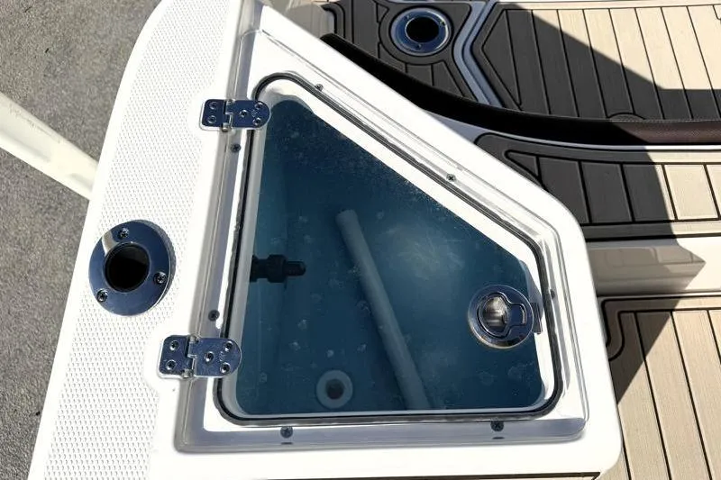 Slide: The Image of 2024 Yamaha Boats 222 FSH Sport livewell with clear lid and deck details. - 36