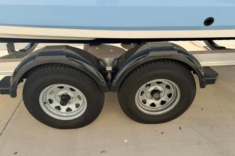 Slide: The Image of Trailer wheels of 2024 Yamaha Boats 222 FSH Sport on pavement. - 46
