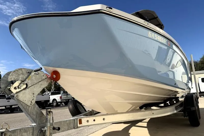 Slide: The Image of 2024 Yamaha Boats 222 FSH Sport on trailer, viewed from front angle. - 9