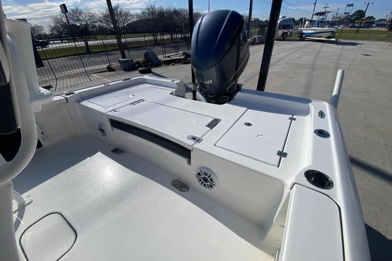 Slide: The Image of 2023 Tidewater 2410 Bay Max boat displayed outdoors, featuring a sleek design and modern equipment. - 13