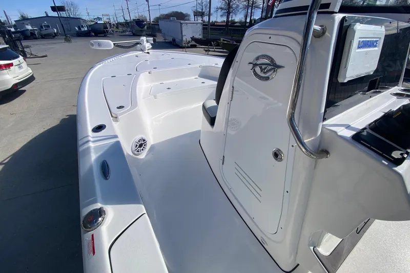 Slide: The Image of 2023 Tidewater 2410 Bay Max boat console with steering wheel and controls. - 19