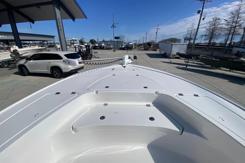 Slide: The Image of 2023 Tidewater 2410 Bay Max boat interior with cushioned seating and modern design. - 22