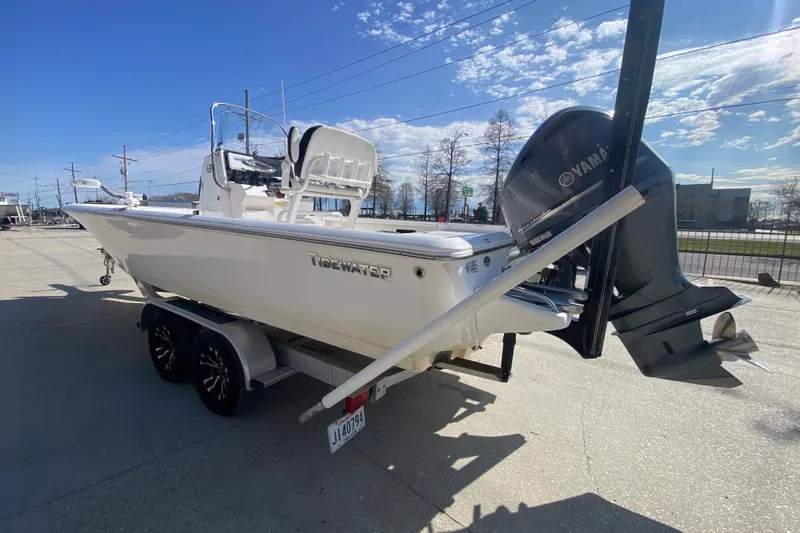 Slide: The Image of 2023 Tidewater 2410 Bay Max boat with powerful 250 engine, parked outdoors. - 7
