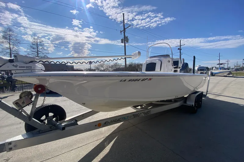 Slide: The Image of 2023 Tidewater 2410 Bay Max boat on trailer, side view under clear blue sky. - 9