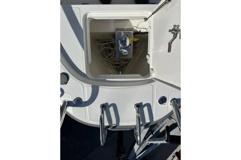 Slide: The Image of Open storage compartment on 2024 Nimbus T-8 boat, showing ropes and equipment. - 10