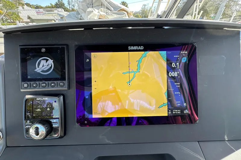 Slide: The Image of Dashboard of 2024 Nimbus T-8 boat with Simrad navigation display. - 15