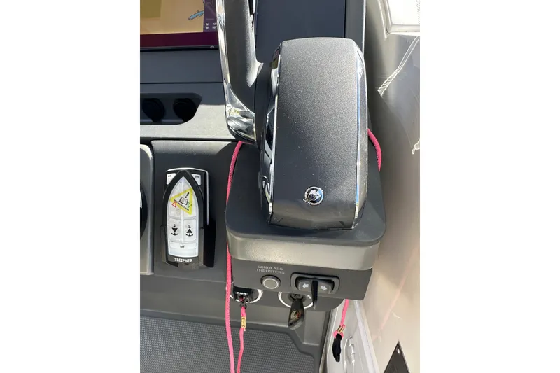 Slide: The Image of 2024 Nimbus T-8 boat control panel with throttle and joystick. - 16