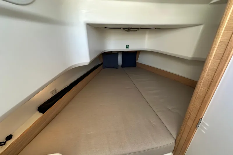 Slide: The Image of 2024 Nimbus T-8 cabin interior with cozy bed and cushions. - 3