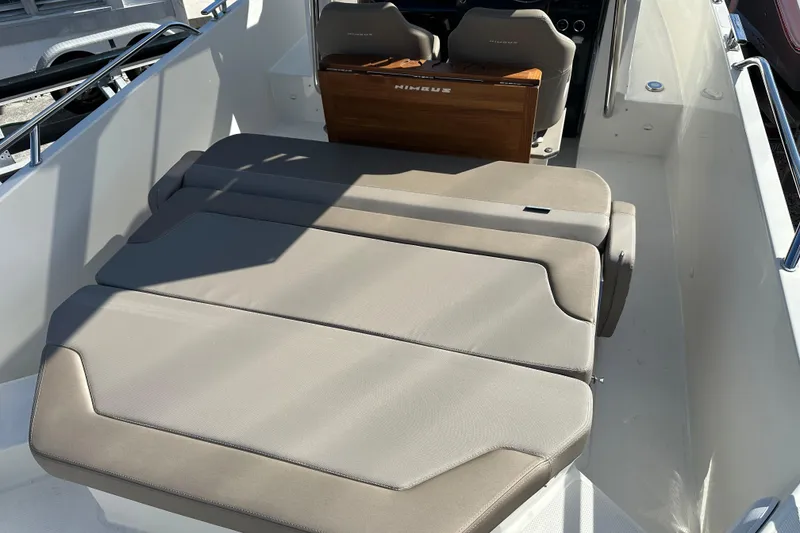 Slide: The Image of 2024 Nimbus T-8 boat interior with beige seating and sleek design. - 6