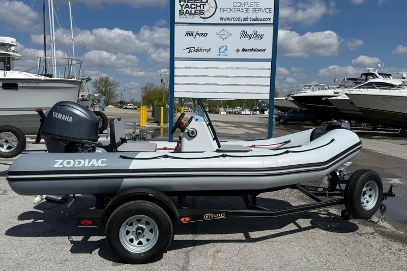 The Image of 2026 Zodiac Open 4.2 boat with Yamaha engine on trailer at yacht sales lot. - 1