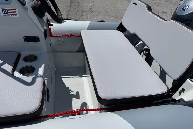 Slide: The Image of Interior view of 2026 Zodiac Open 4.2 boat with seating and cup holders. - 11