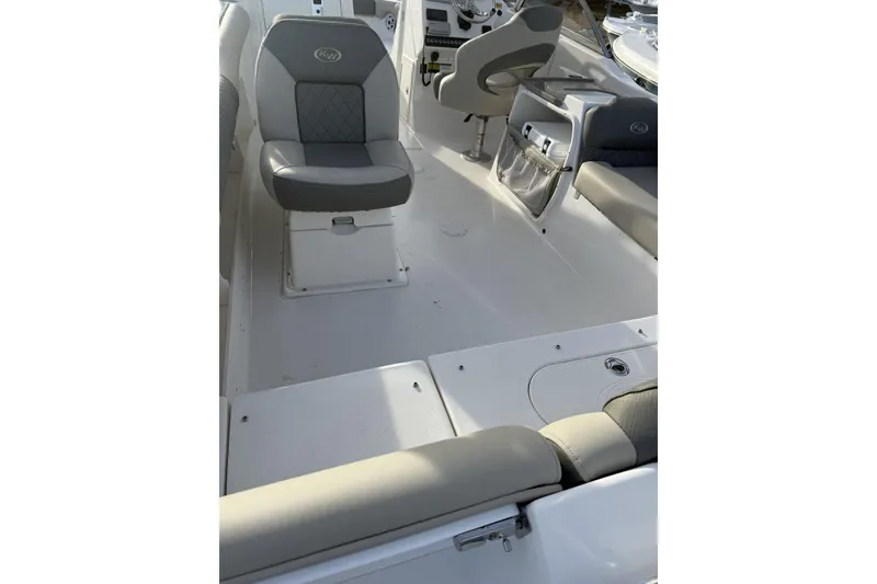 Slide: The Image of 2026 Key West 239 DFS boat interior with gray seating and modern design. - 3