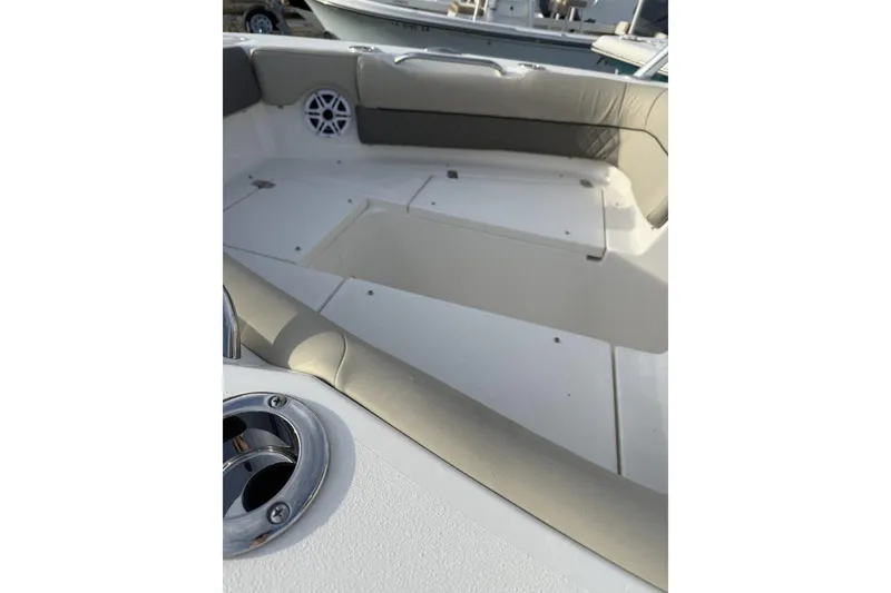 Slide: The Image of Interior view of 2026 Key West 239 DFS boat, featuring seating and storage compartments. - 7