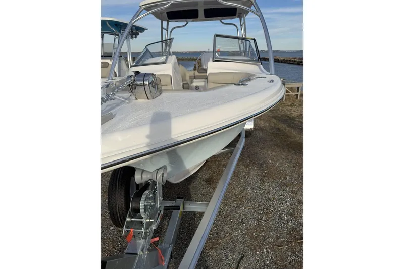 Slide: The Image of 2026 Key West 239 DFS boat on trailer by the water. - 8