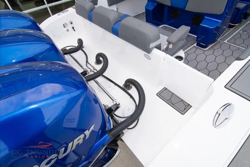 Slide: The Image of 2022 Fountain 38 SC boat interior with blue lighting and seating in showroom. - 12