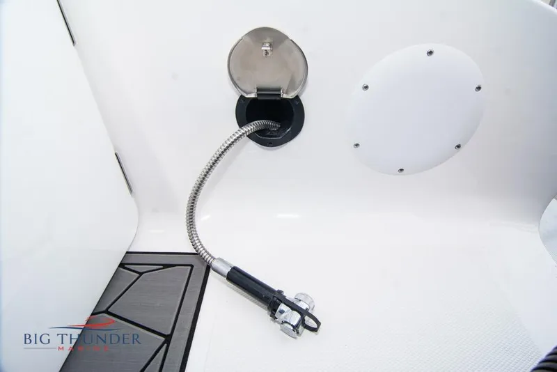 Slide: The Image of 2022 Fountain 38 SC boat interior with blue lighting and modern seating. - 13